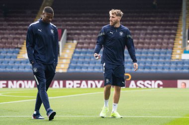 Marvin Ekpiteta #21 and Daniel Grimshaw #32 of Blackpool  arrives at Turf Moor, Home of Burnley