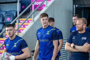 Riley Dean #27 of Warrington Wolves comes out of the tunnel for the pre match warm up 
