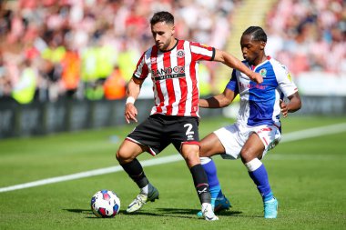 George Baldock #2 of Sheffield United and Tayo Edun #7 of Blackburn Rovers  