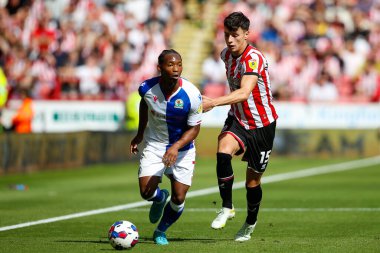 Tayo Edun #7 of Blackburn Rovers  and Anel Ahmedhodzic #15 of Sheffield United 