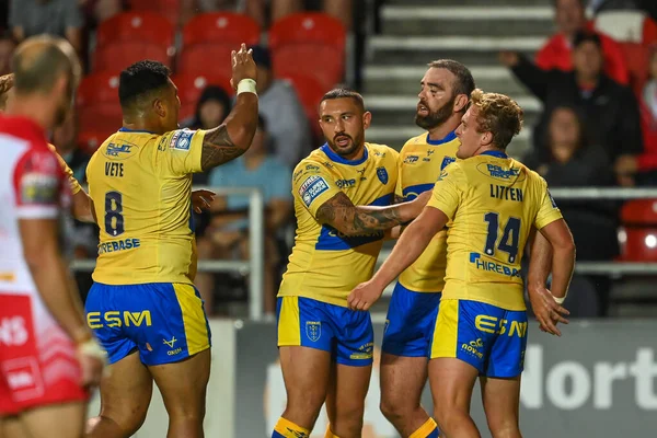 Kane Linnett #12 of Hull KR celebrates his try