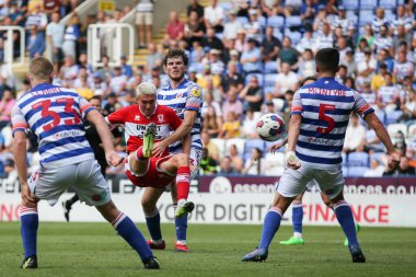 Matthew Hoppe #13 of Middlesbrough goes down under a challenge from Tom Holmes #3 of Reading 