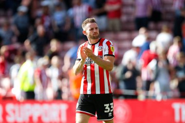 Rhys Norrington-Davies #33 of Sheffield United applauds fans after the game