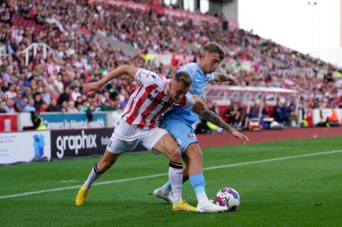 Ben Wilmot #16 of Stoke City competes for the ball with Jack Clarke #20 of Sunderland 