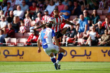 Max Lowe #13 of Sheffield United and Callum Brittain #2 of Blackburn Rovers  