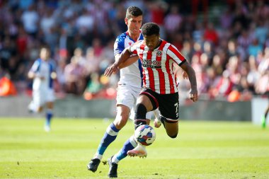 Rhian Brewster #7 of Sheffield United and Daniel Ayala #4 of Blackburn Rovers  