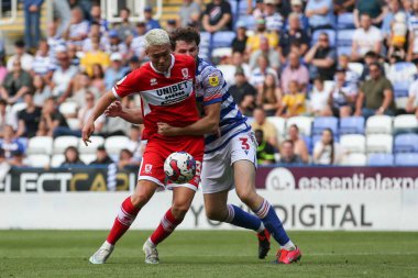 Matthew Hoppe #13 of Middlesbrough and Tom Holmes #3 of Reading tussle for the ball