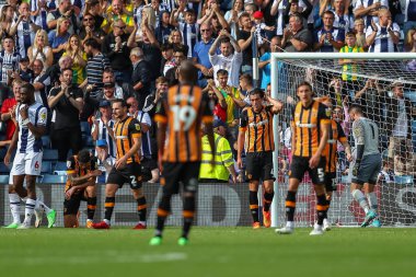 Hull City players look dejected after Dara O'Shea #4 of West Bromwich Albion scores a goal to make it 5-1