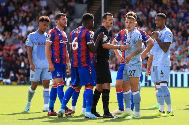 Lucas Digne of Aston Villa pleads innocence to the official. 