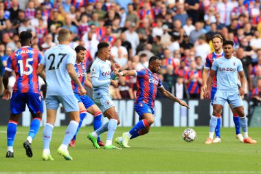 Jordan Ayew of Crystal Palace holds off Jacob Ramsey of Aston Villa.