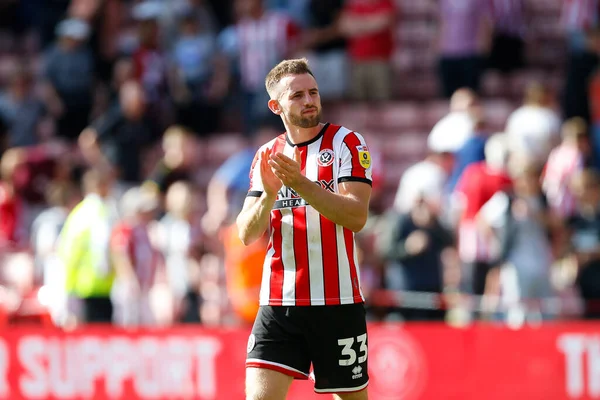 Rhys Norrington-Davies #33 of Sheffield United applauds fans after the game
