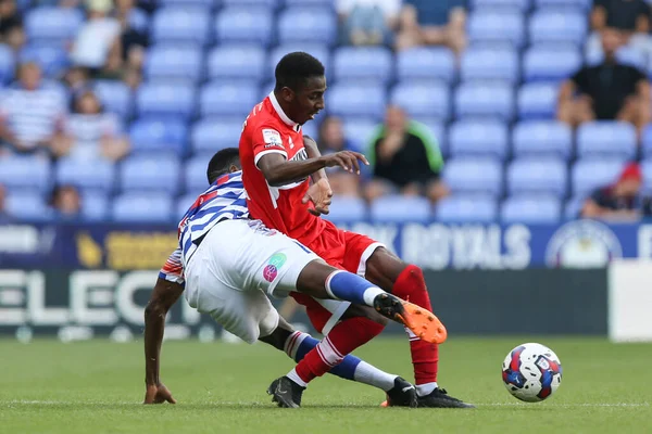 Isaiah Jones #2 of Middlesbrough and Tom Ince #10 of Reading tussle for the ball