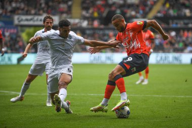 Carlton Morris #9 of Luton Town Under pressure from Ben Cabango #5 of Swansea City 
