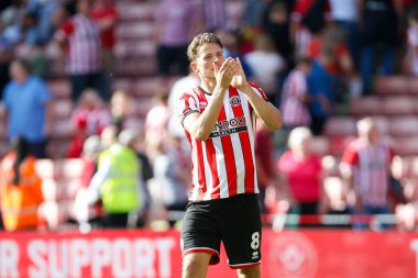 Sander Berge #8 of Sheffield United applauds fans after the game