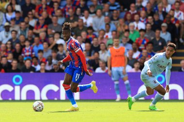 Wilfried Zaha of Crystal Palace evades Jacob Ramsey of Aston Villa.