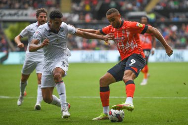 Carlton Morris #9 of Luton Town Under pressure from Ben Cabango #5 of Swansea City 