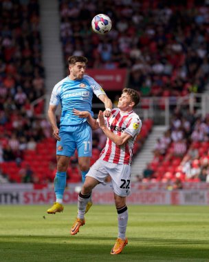 Gavin Kilkenny #22 of Stoke City competes for a header with Lynden Gooch #11 of Sunderland 
