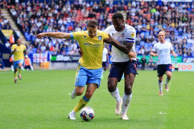 Lee Gregory #9 of Sheffield Wednesday and Ricardo Santos #5 of Bolton Wanderers challenge for the ball