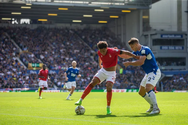 Brennan Johnson #20 of Nottingham Forest looks to beat James Tarkowski #2 of Everton