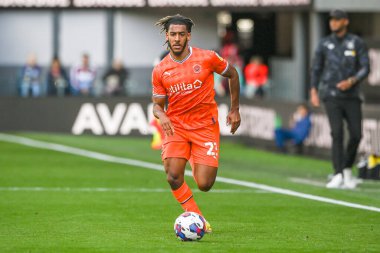 Dominic Thompson #23 of Blackpool makes a break with the ball