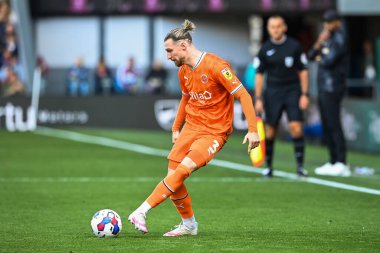 James Husband #3 of Blackpool passes the ball
