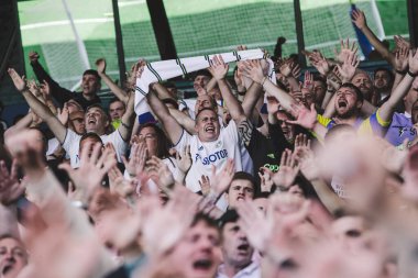 The Leeds United supporters cheer on their team during the game 
