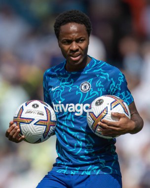 Raheem Sterling #17 of Chelsea holding two footballs during the pre match warm up 
