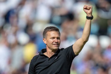 Jesse Marsch manager of Leeds United pumps his fist and celebrates the victory over Chelsea 3-0 with the supporters 