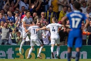 Rodrigo Moreno #19 of Leeds United celebrates with goalscorer Jack Harrison as he scores the third goal of the game and makes it 3-0