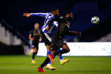 Sylla Sow #40 of Sheffield Wednesday and Ethan Ebanks-Landell #6 of Rochdale