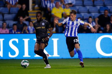 Jay Glover #23 of Sheffield Wednesday and Cameron John #24 of Rochdale