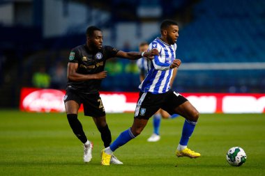 Sylla Sow #40 of Sheffield Wednesday and Cameron John #24 of Rochdale