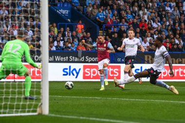 Danny Ings #9 of Aston Villa  shoots on goal but its saved by Joel Dixon #12 of Bolton Wanderers