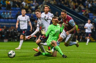 Joel Dixon #12 of Bolton Wanderers brings down Danny Ings #9 of Aston Villa  for a penalty