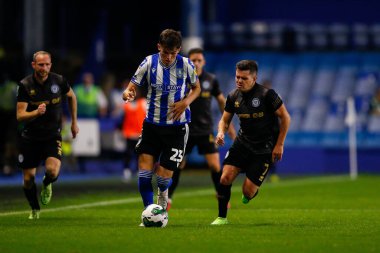 Jay Glover #23 of Sheffield Wednesday and Liam Kelly #7 of Rochdale