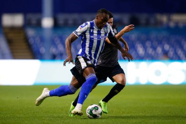 Dennis Adeniran #8 of Sheffield Wednesday and Liam Kelly #7 of Rochdale