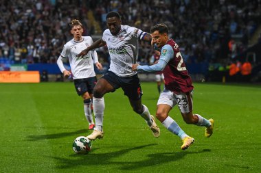 Philippe Coutinho #23 of Aston Villa and Ricardo Santos #5 of Bolton Wanderers battle for the ball