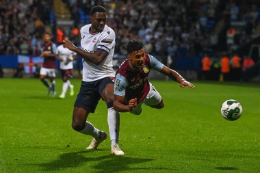 Ricardo Santos #5 of Bolton Wanderers and Ollie Watkins #11 of Aston Villa battle for the ball