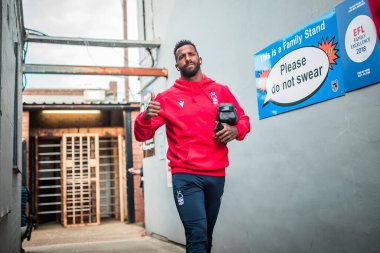Caf #18 of Nottingham Forest arrives at Blundell Park 