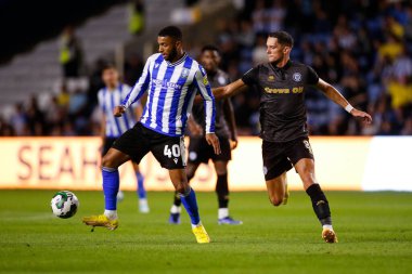 Sylla Sow #40 of Sheffield Wednesday and James Ball #8 of Rochdale