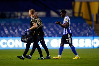 Fisayo Dele-Bashiru #17 of Sheffield Wednesday goes off injured