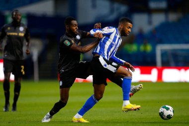 Sylla Sow #40 of Sheffield Wednesday and Cameron John #24 of Rochdale