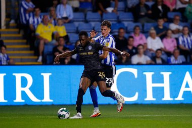 Jay Glover #23 of Sheffield Wednesday and Cameron John #24 of Rochdale