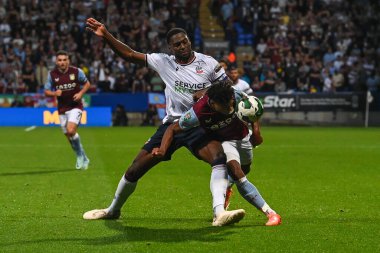 Ricardo Santos #5 of Bolton Wanderers and Ollie Watkins #11 of Aston Villa battle for the ball