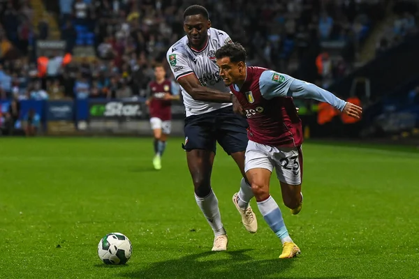 Philippe Coutinho #23 of Aston Villa and Ricardo Santos #5 of Bolton Wanderers battle for the ball