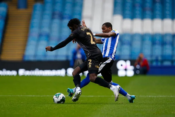 Jaden Brown #3 of Sheffield Wednesday and Femi Seriki #2 of Rochdale