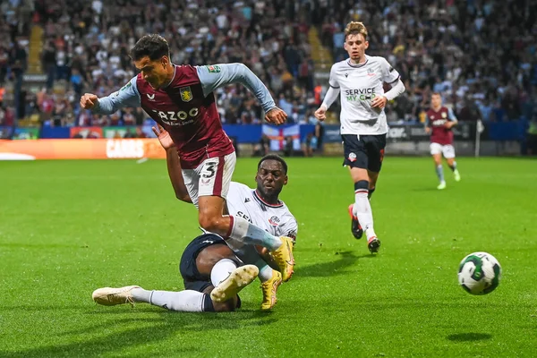 Philippe Coutinho #23 of Aston Villa  is tackled by Ricardo Santos #5 of Bolton Wanderers