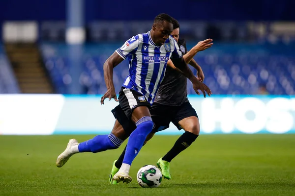 Dennis Adeniran #8 of Sheffield Wednesday and Liam Kelly #7 of Rochdale