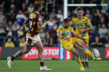 Aidan Sezer #7 of Leeds Rhinos puts a high kick up the pitch