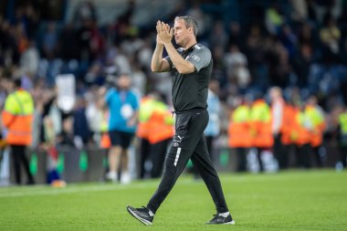 Michael Duff Head coach of Barnsley claps his hands and applauds the travelling supporters at full-time 